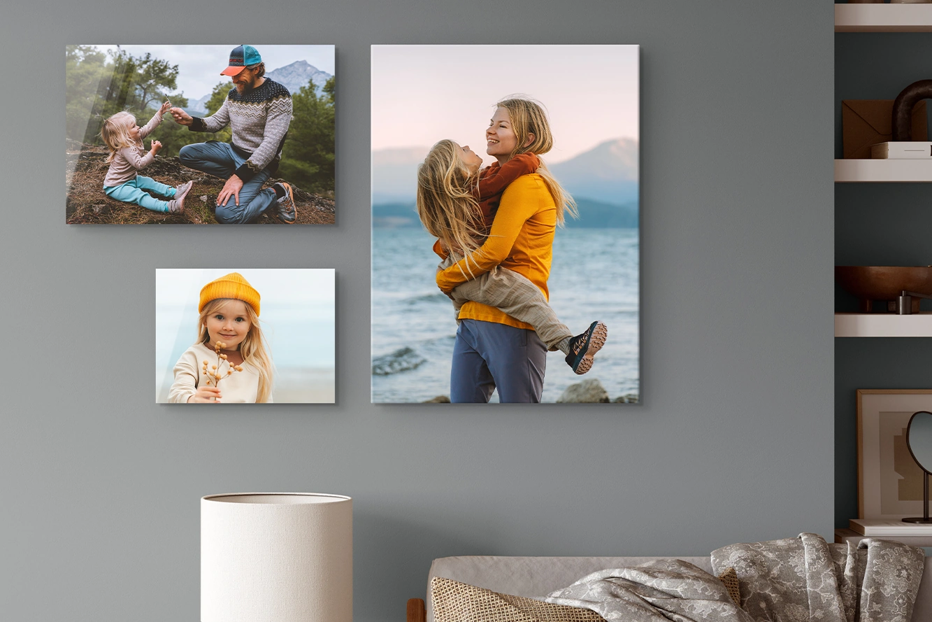 Three family photo prints arranged on a living-room wall