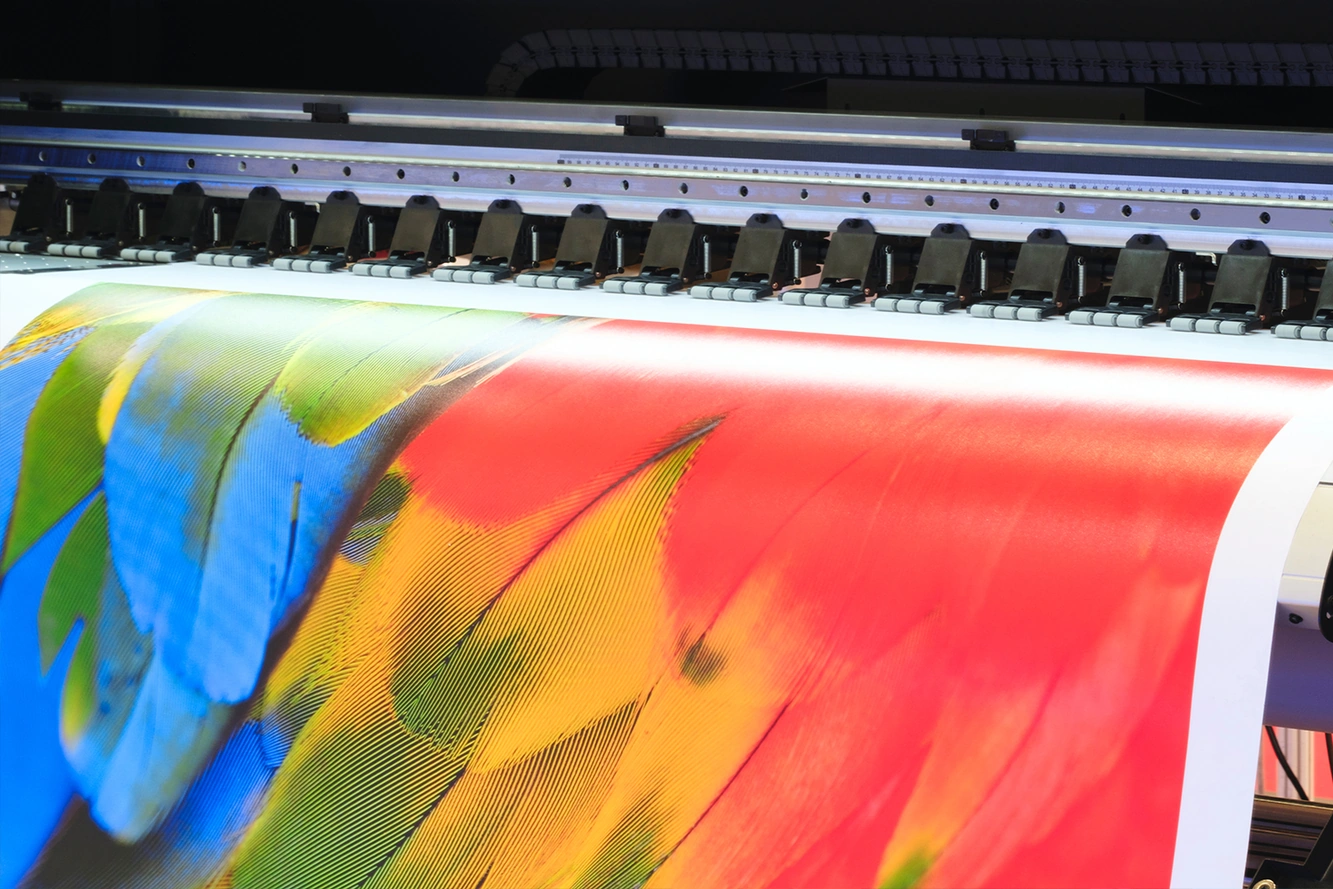 Wide-format printer printing a colorful photo