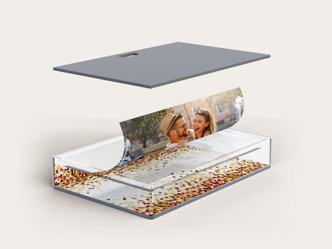 Opened snow globe frame showing the replaceable photo and glitter compartment