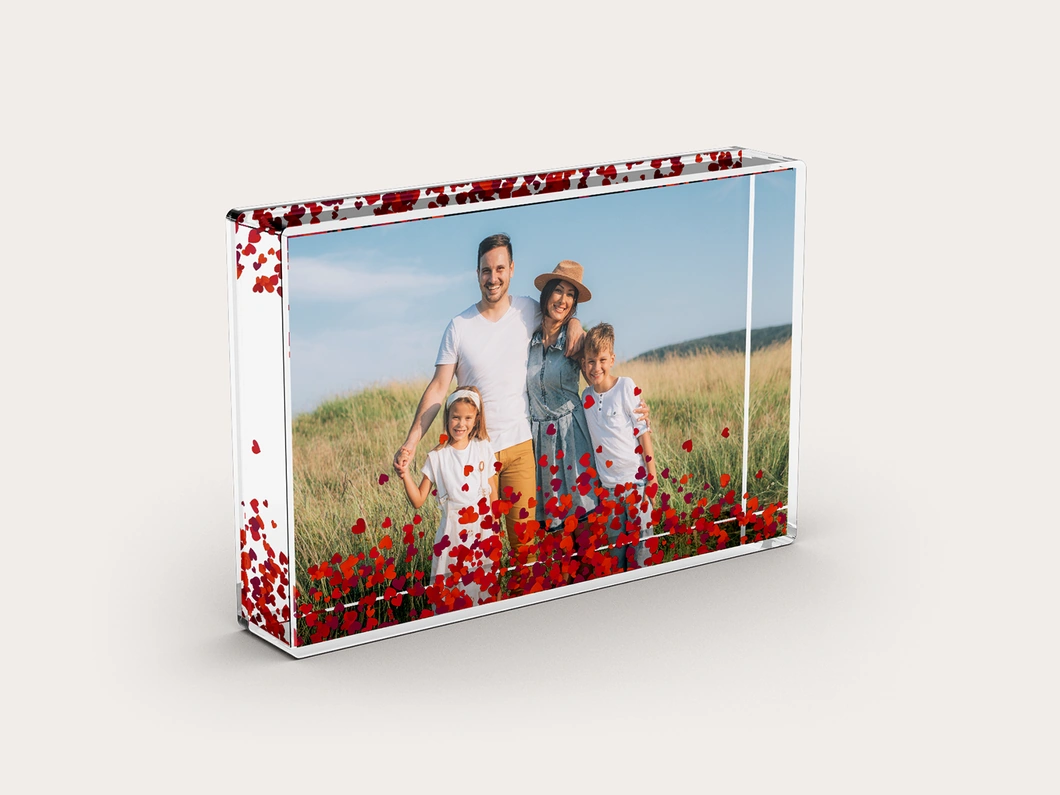 Snow globe frame with a family photo and red heart glitter