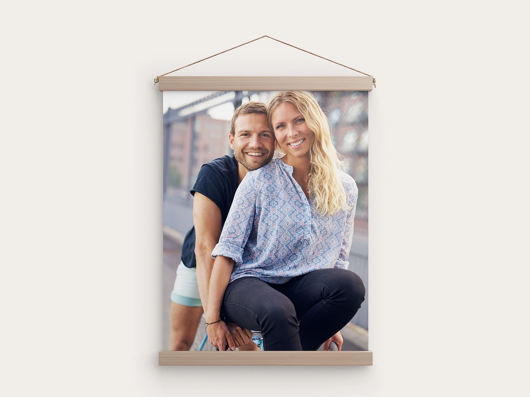 Canvas wall hanging with a couple's photo and wooden rails