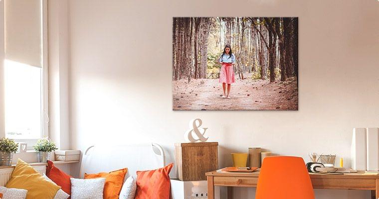 Large 36x24 photo canvas print hanging above a living room sofa