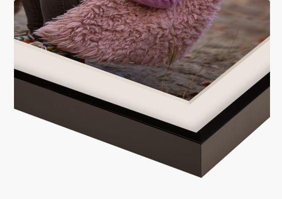 framed photo prints in black frame closeup front