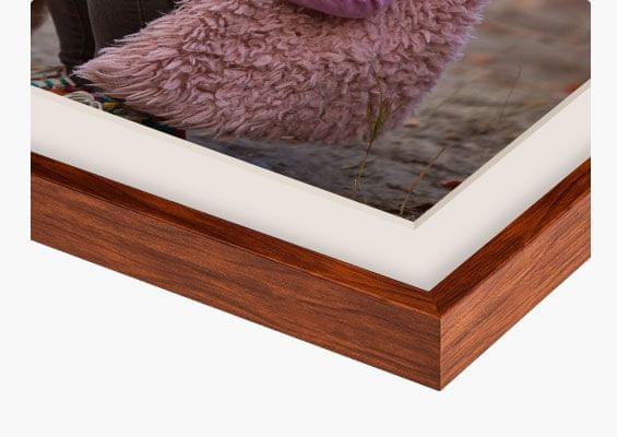 framed prints in brown frame closeup front