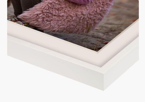 custom framed prints in white frame closeup front