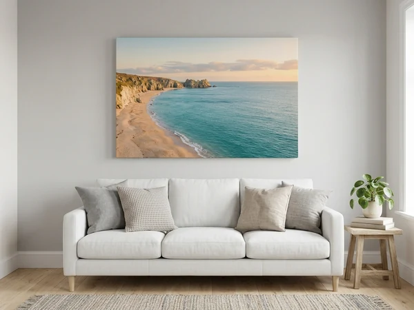 A large landscape photo canvas hung centrally above a sofa, filling about two thirds of the wall behind it