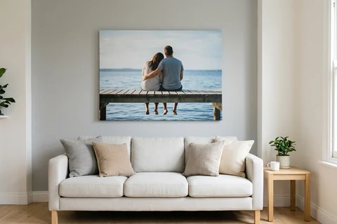 A large landscape photo canvas hung centrally above a sofa